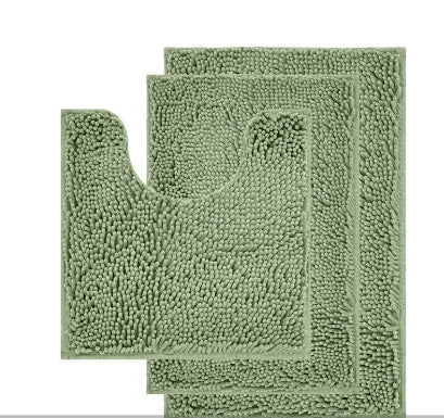 Dark green chenille three-piece U-shaped toilet mat set with non-slip TPR backing on bathroom floor.