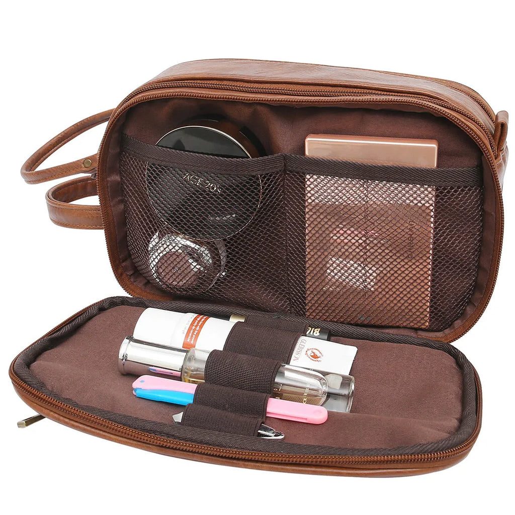 Black and brown men's Pu leather toiletry bag with zipped compartments open.