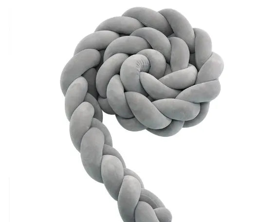 Braided knot style baby cot bumper in spandex crystal velvet fabric, shown in a light grey colour.