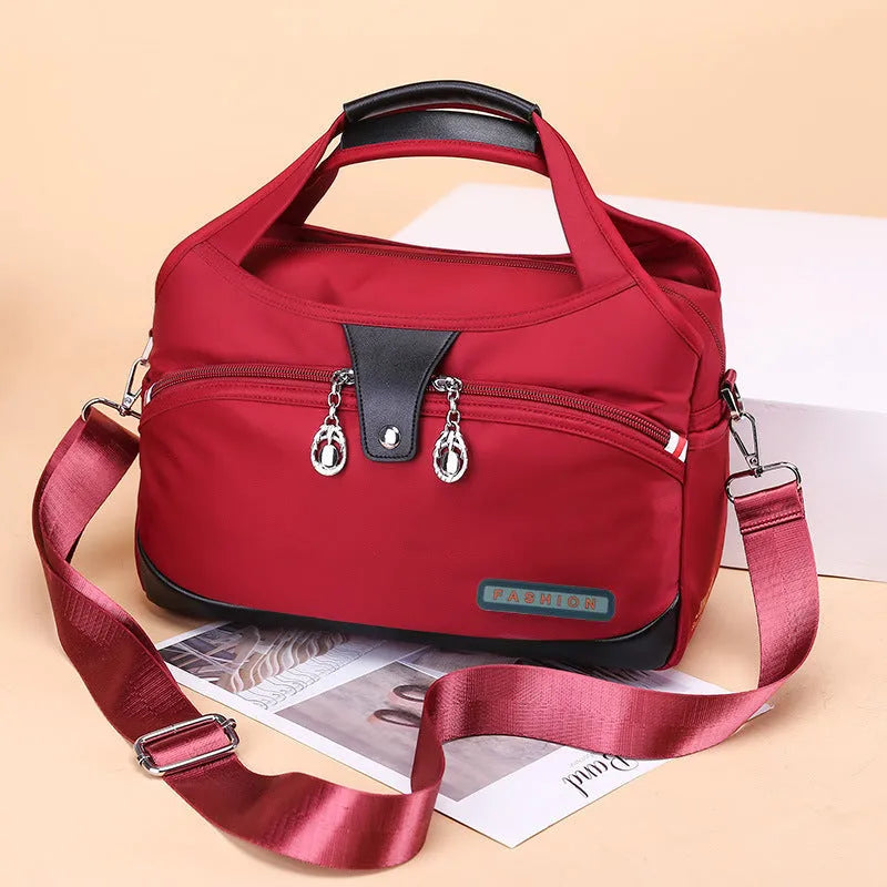 Women's anti-theft crossbody shoulder bag in Oxford cloth with multiple pockets and adjustable strap