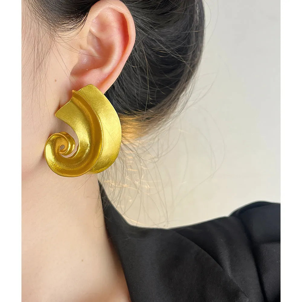 Geometric retro ear studs in gold and silver colours measuring 5cm with alloy construction