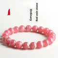 Women's geometric crystal bracelet with a longevity lock clasp in natural red rhodochrosite stone.