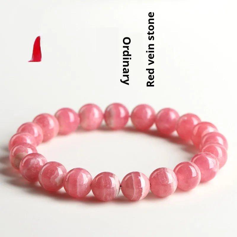 Women's geometric crystal bracelet with a longevity lock clasp in natural red rhodochrosite stone.