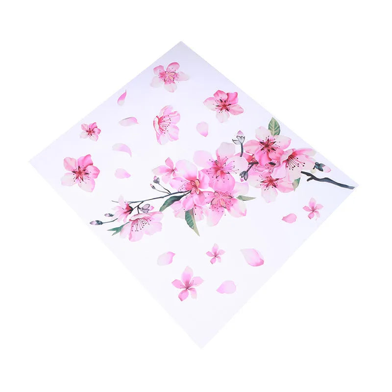 Close-up of a cherry blossom flower pattern on a PVC car sticker, shown with a peel-off backing.