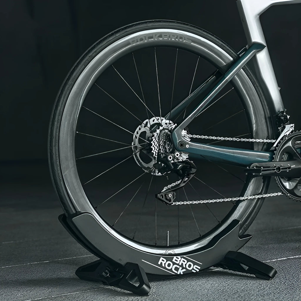 Black and green ABS plastic fixed bracket for mountain bike and road bike parking.