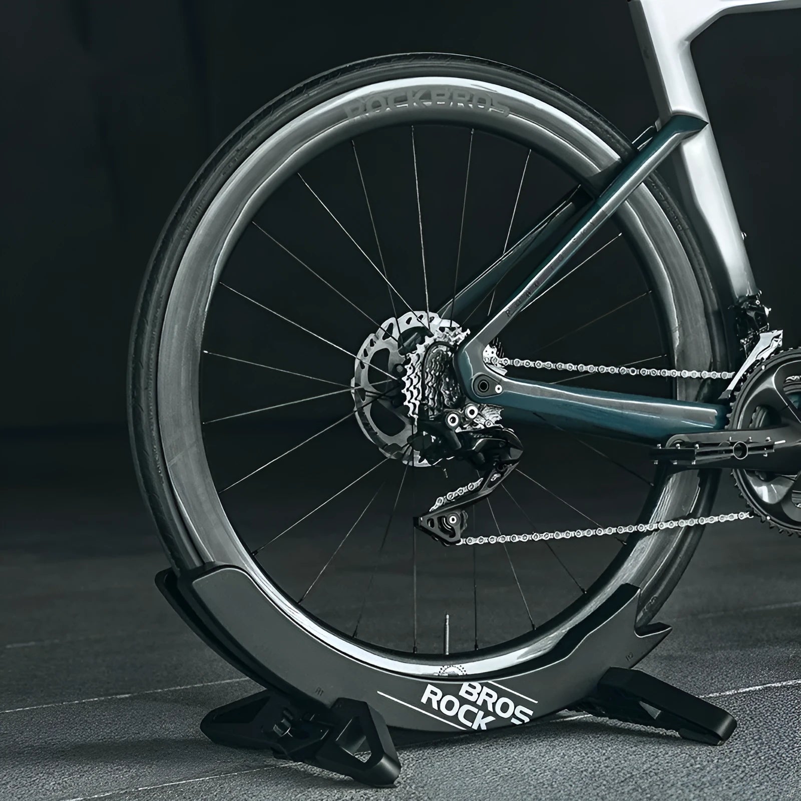 Black and green ABS plastic fixed bracket for mountain bike and road bike parking.