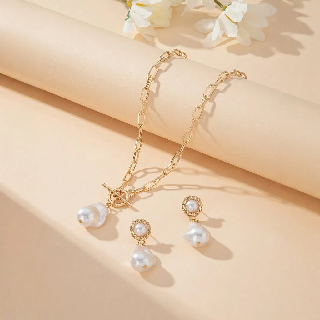 Gold tone retro baroque pearl necklace and matching ear stud set for women.