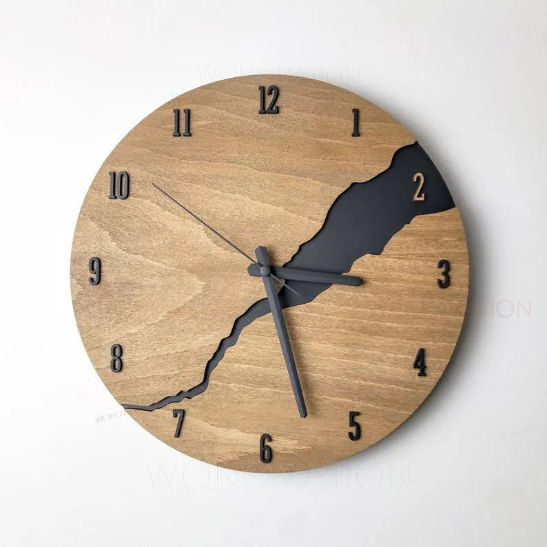 Modern wooden wall clock with a creative crack effect finish on its face, showing a silent second hand.