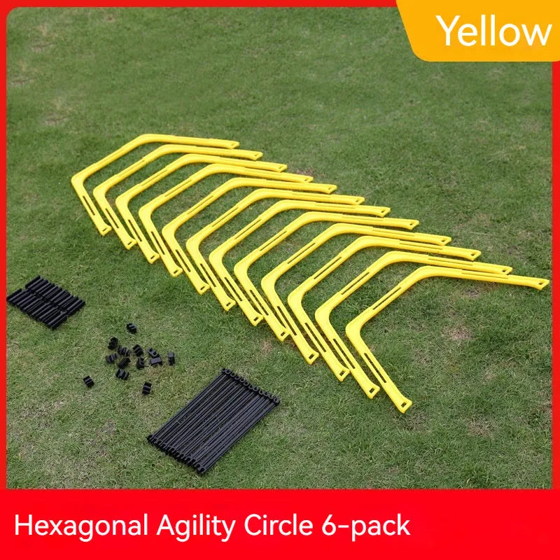 Set of six foldable yellow, green, and orange hexagon agility training rings on grass.