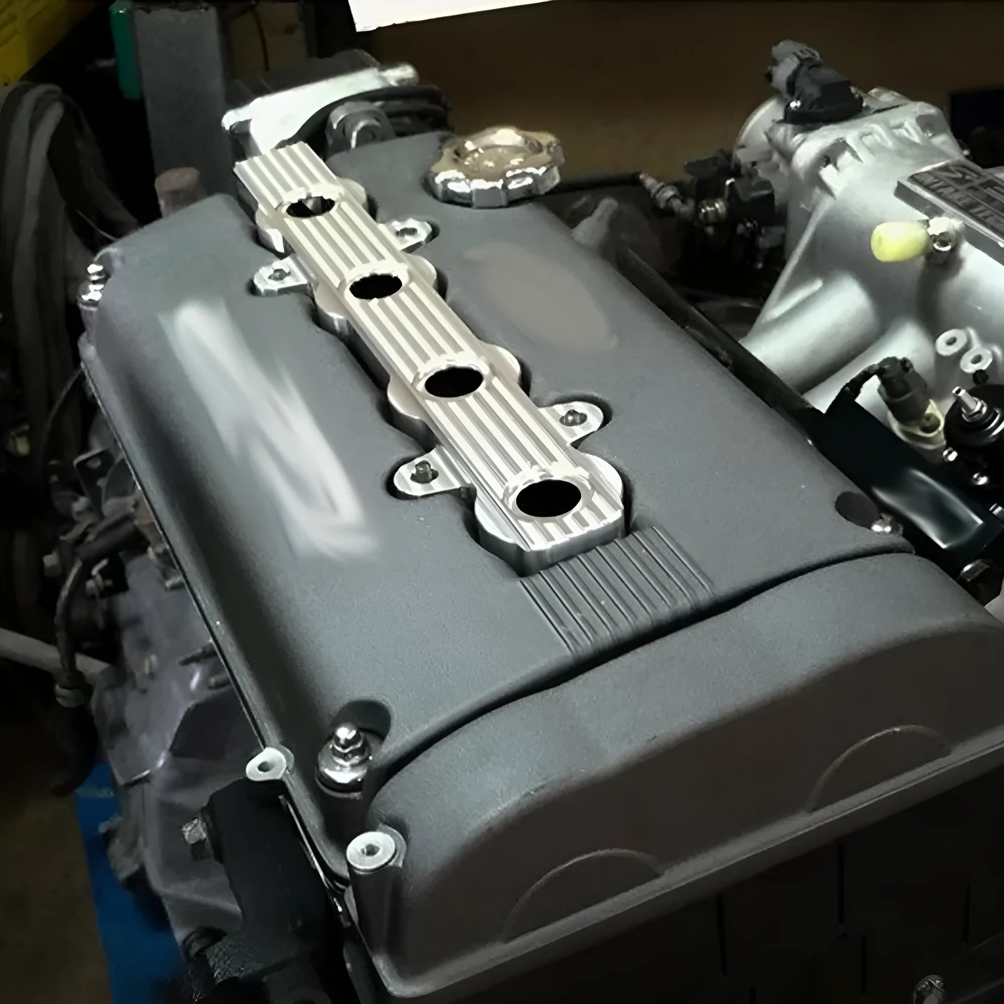 Aluminium alloy engine cover shown in red, blue, and silver colour options