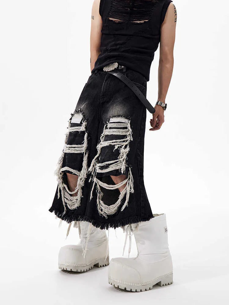 Black cropped wide-leg women's jeans with ripped patches on the knees.