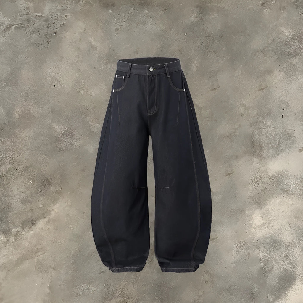 Men's original cow colour wide leg denim trousers laid flat, showing mid waist and straight leg cut.