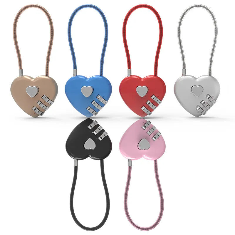 Peach heart shaped wire rope lock in multiple colours with a long steel cable, shown next to a bicycle helmet.