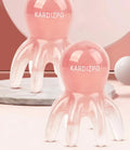 Small pink octopus-shaped massage comb made of natural resin with a storage bag.