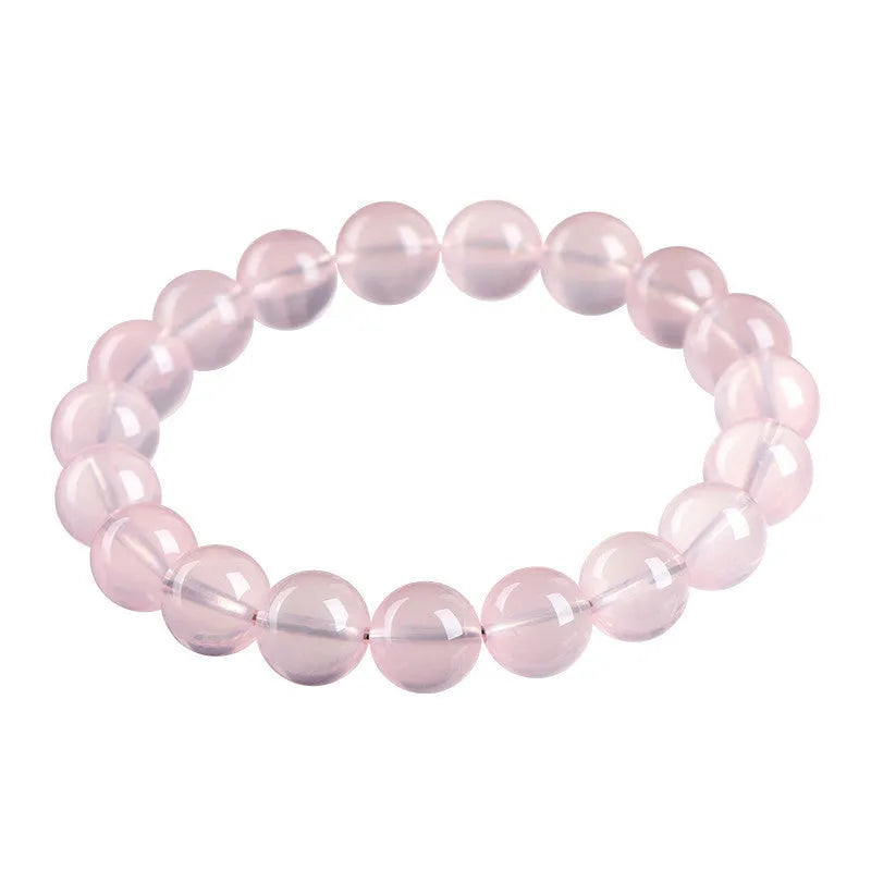 Polished natural crystal bracelet with round beads in pink colour, available in multiple bead diameters