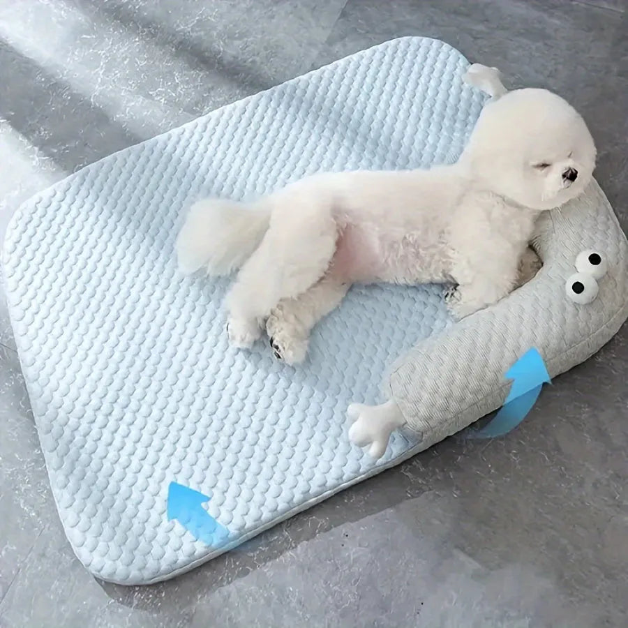 Blue big-eyed monster design pet bed cushion for dogs on a wooden floor.