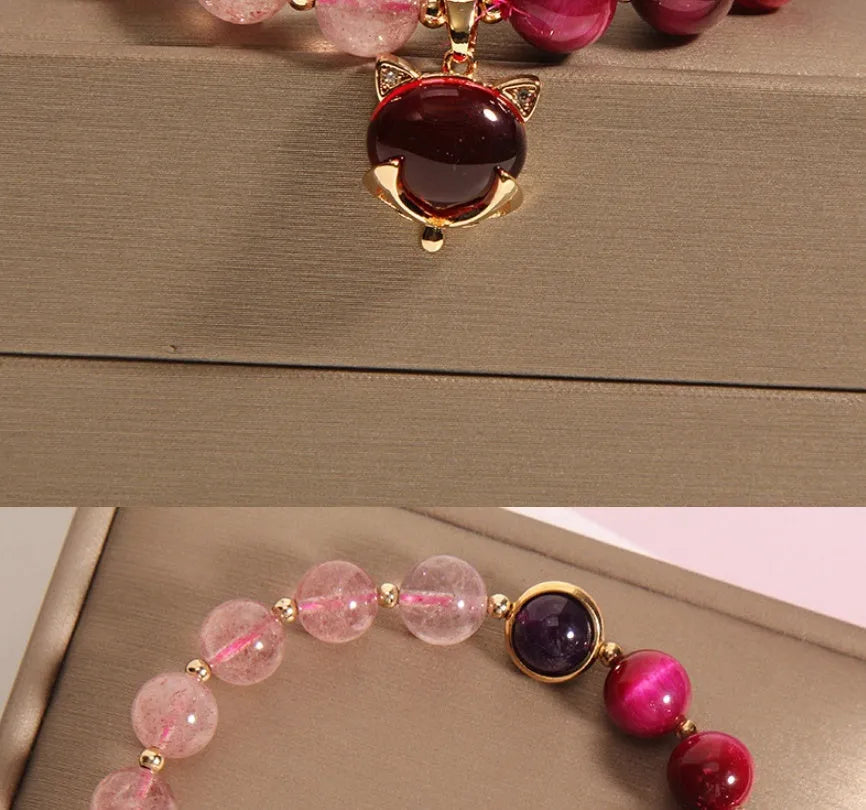 Simple women's bracelet made of transparent strawberry crystal beads on a black elastic rope.