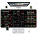 Large black gaming mouse pad with colourful game character artwork print on a desk