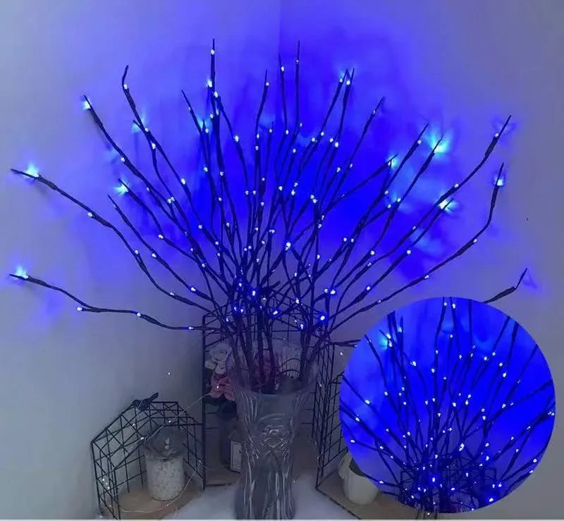 LED decorative tree light in a vase with colourful or warm white lighting options.