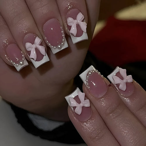 Artificial French manicure nail set with bow decorations and multiple patterns