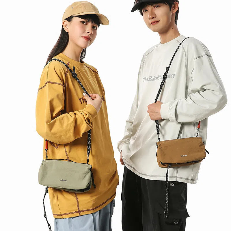 Women's sports crossbody bag nylon pillow shape 22cm length 4cm width 9cm height stitching black