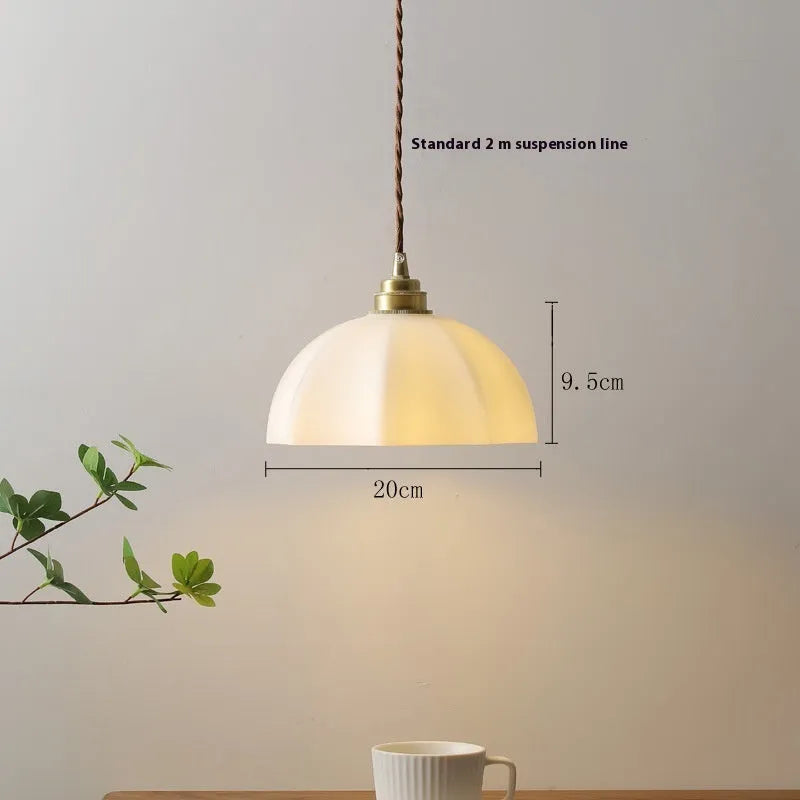 Brass Chinese-style pendant light with copper glass shade for indoor ceiling mounting