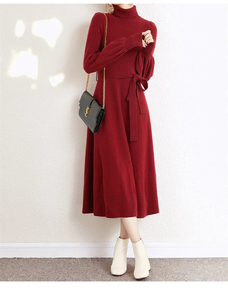 Rose red loose fit turtleneck knitted dress with long sleeves and a midi-length skirt.