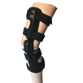 Black anterior ligament knee pad with visible metal stabiliser, shown in a left-leg size.