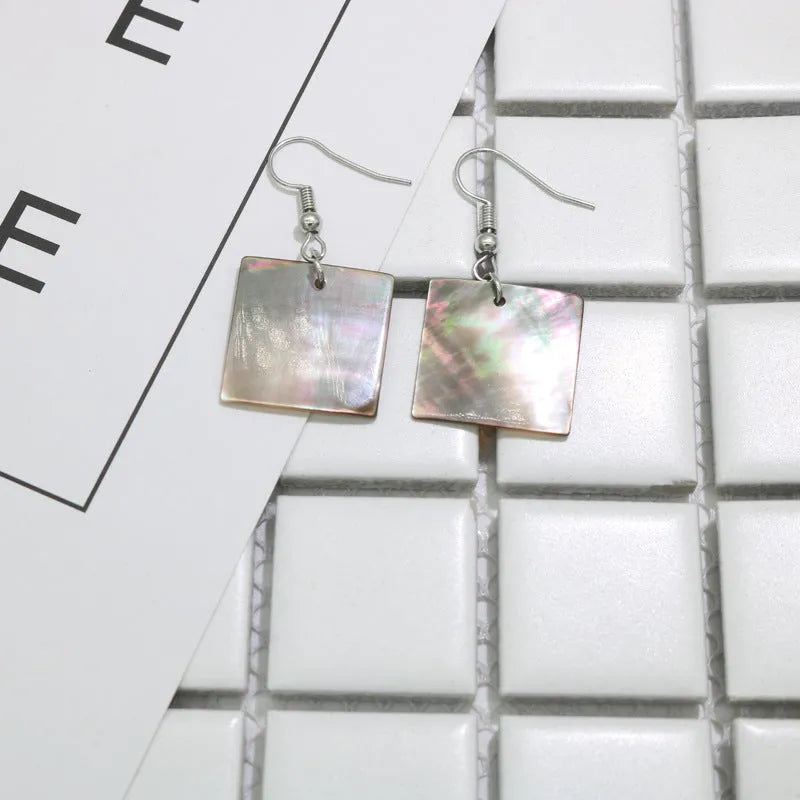 Women's geometric shell earrings in square panther or rectangular shell designs with natural material