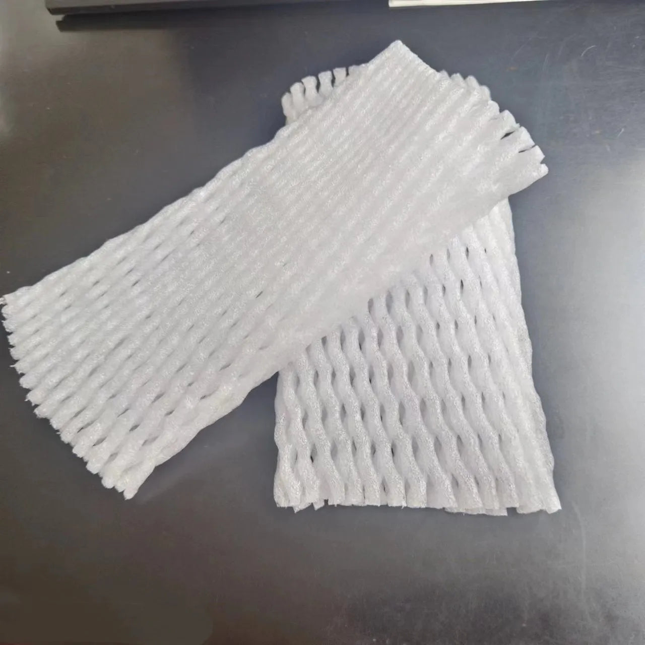 White foam fruit protective net cover shown in multiple size options for transport protection