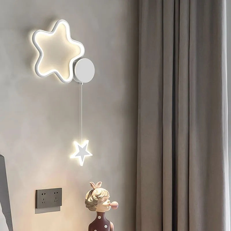 Cartoon cloud and five-pointed star themed bedside wall lamp for a child's room.