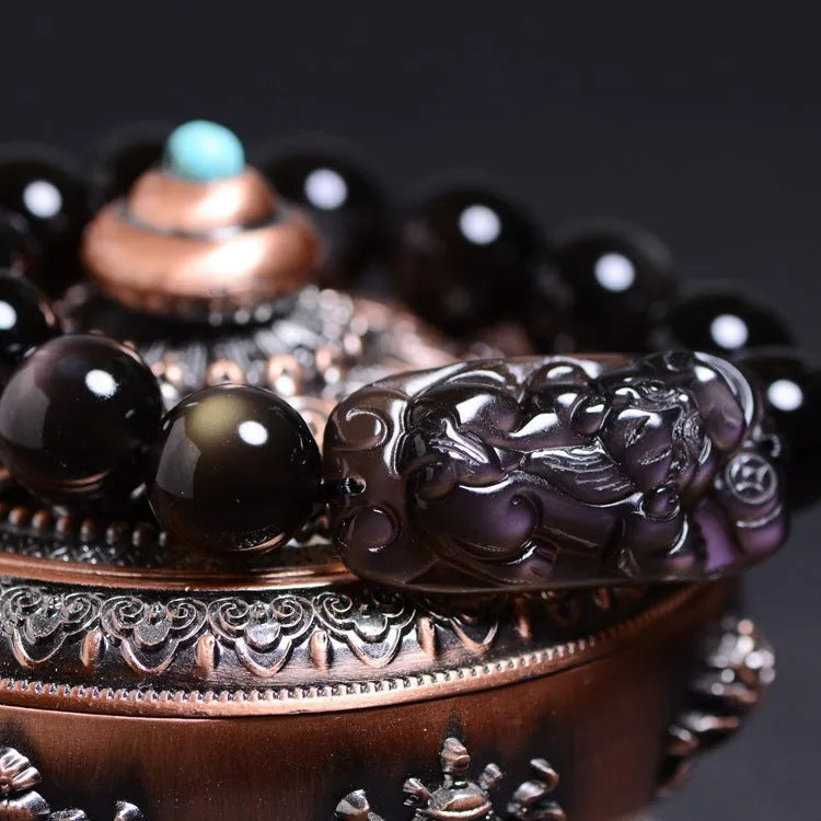 A polished crystal Pi Xiu bracelet with geometric beads on a wrist, shown in Ice Stone and Double Eye Ice Stone variants.