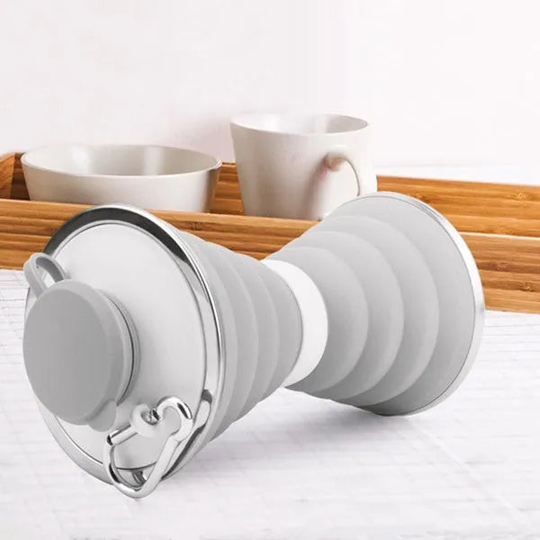 Collapsed and unfolded 500ml silicone travel cup in various colours with lid and carry hook