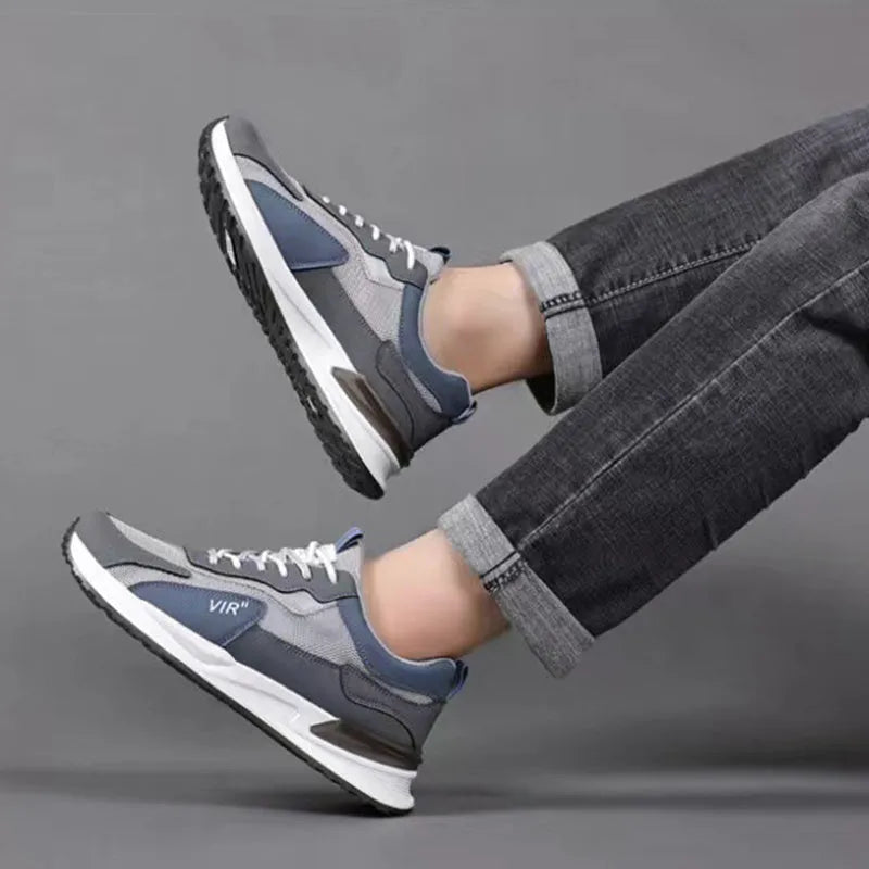 Men's colour block mesh lace-up sneakers in black, grey, and white on a injection moulded sole.