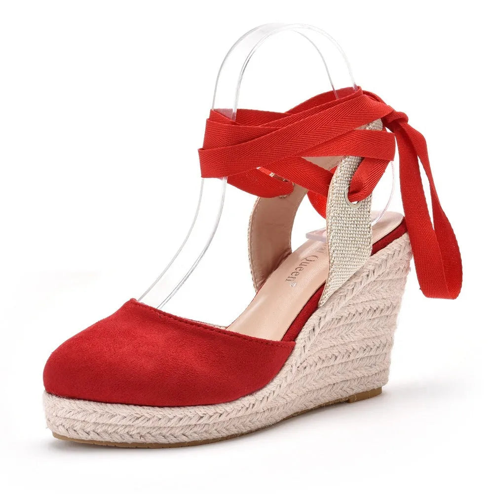 Women's apricot Bohemian wedge sandals with beaded tassels, a buckle, and a platform sole.