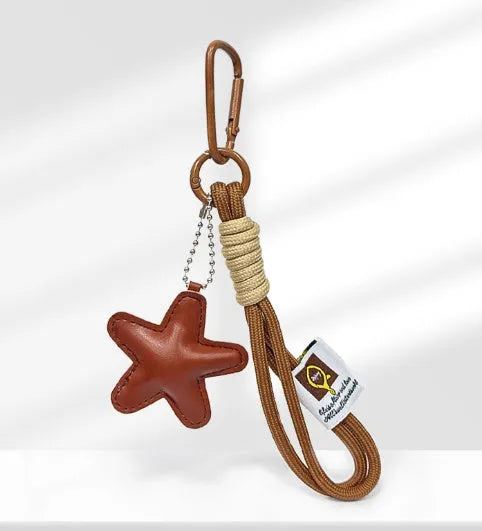Handmade soda bread design handbag pendant with brown star carrying strap and baking varnish finish