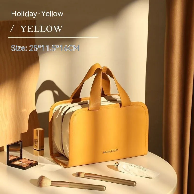 Large capacity leather book cosmetic bag in sunset yellow, open to show interior, with imitation leather finish.