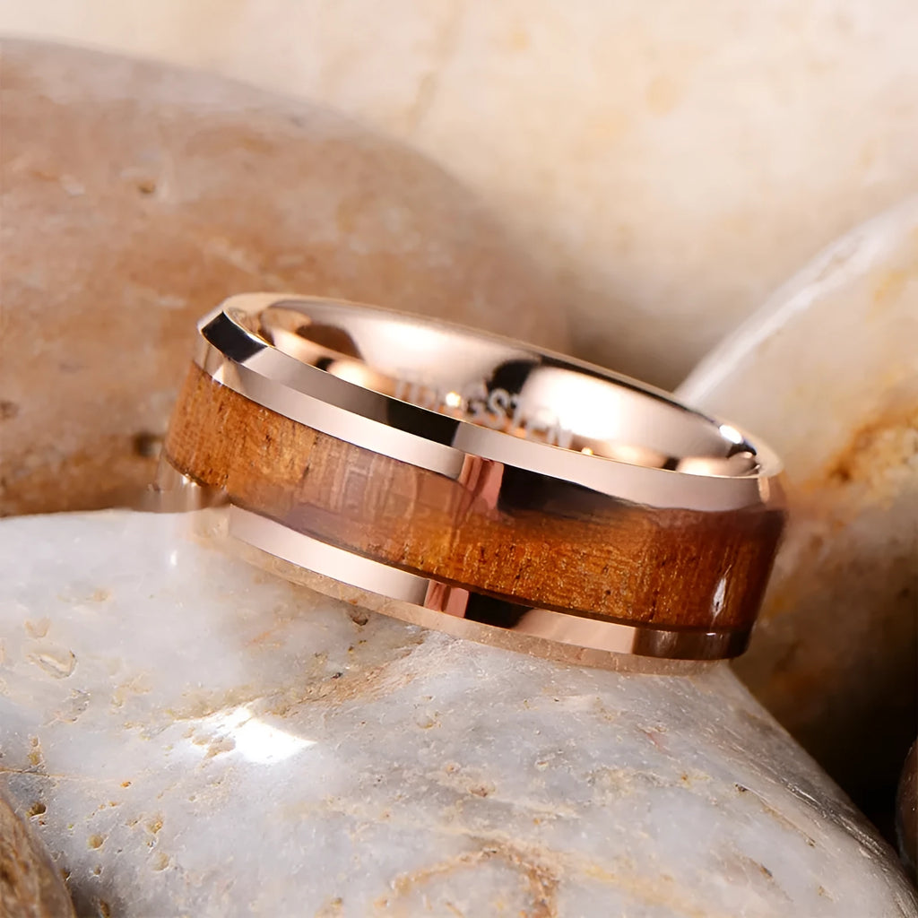8mm wide Ugyen tungsten ring in rose gold or steel colour on a plain background.