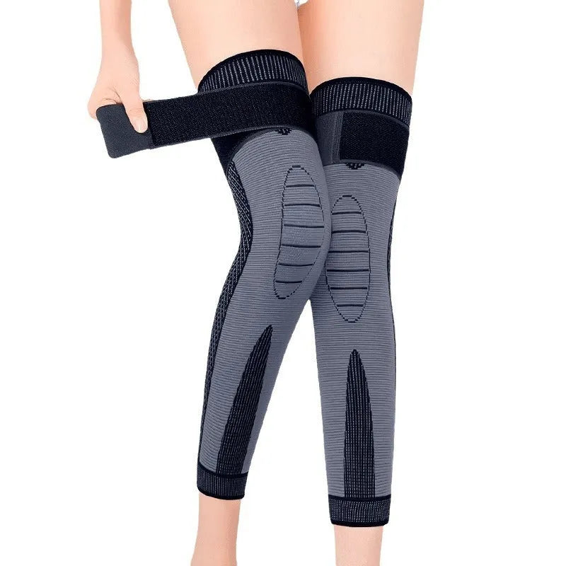 Self-heating knee pad pair with Argy Wormwood bandage, polyester, sizes M L XL, black green orange