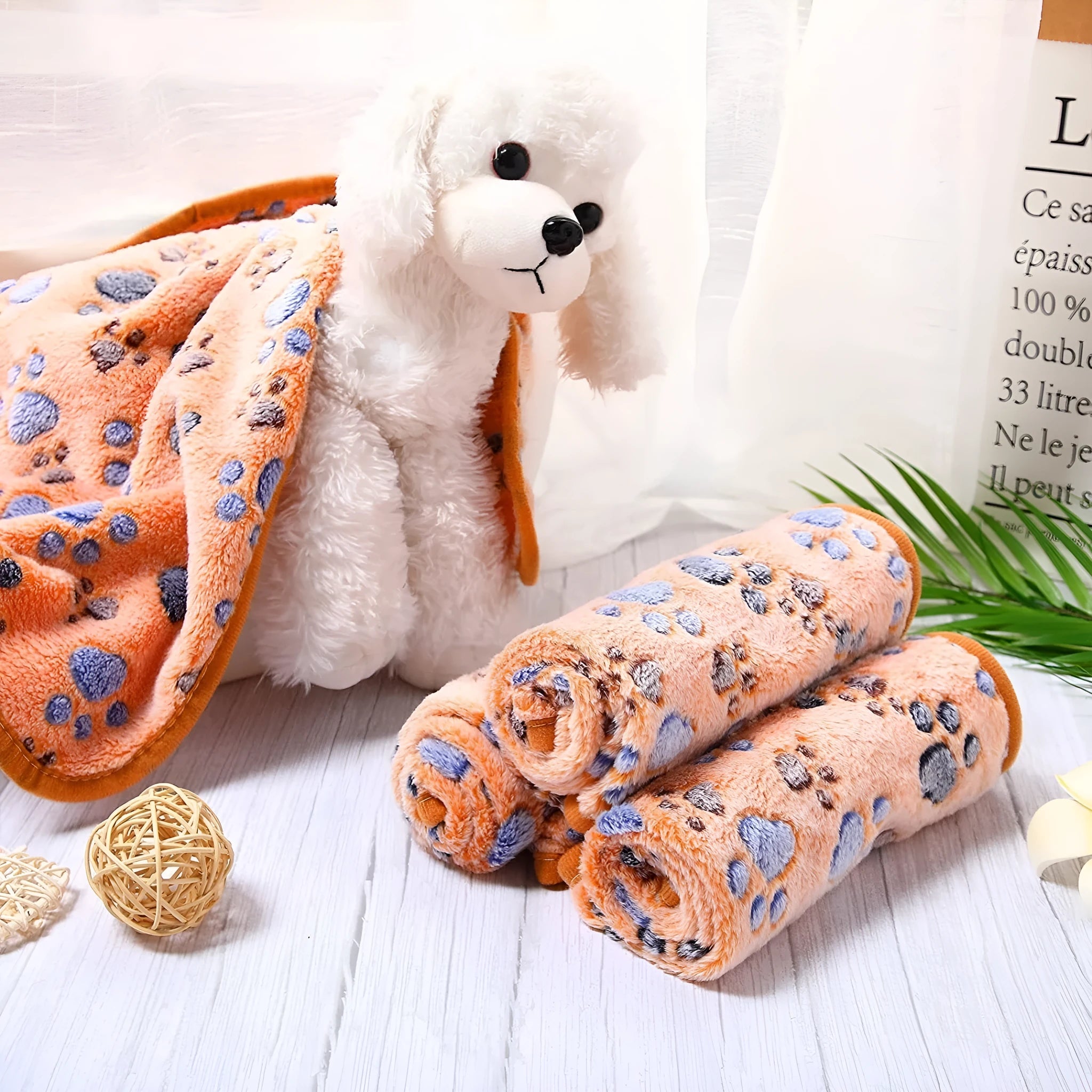 Coral fleece dog blanket with paw print design in multiple size options
