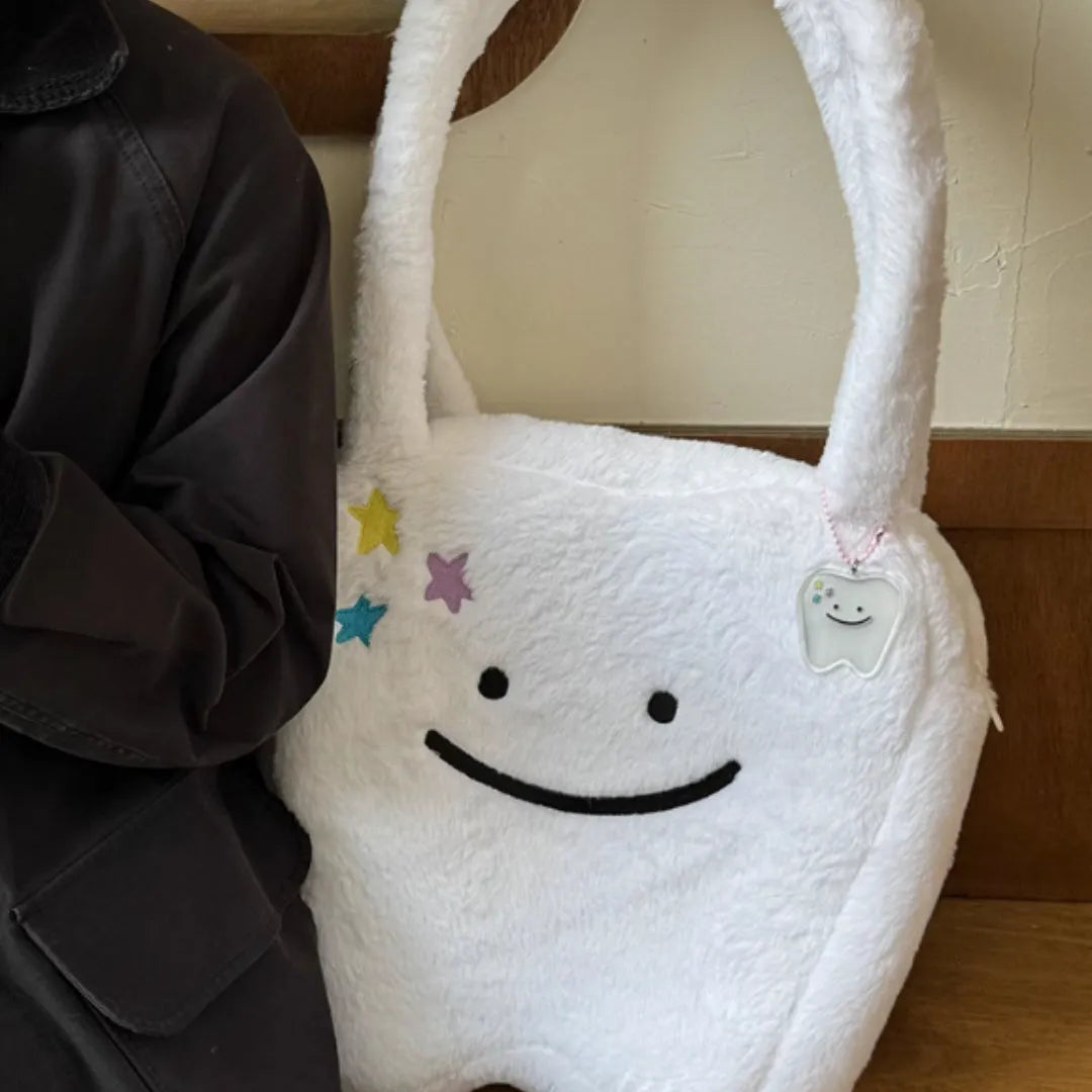 White crossbody shoulder bag with plush large tooth pattern and zipper closure
