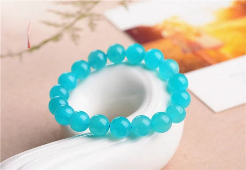 Grade 7A Amazonite natural stone scattered beads arranged on a bracelet, showing blue-green colour and polished finish.