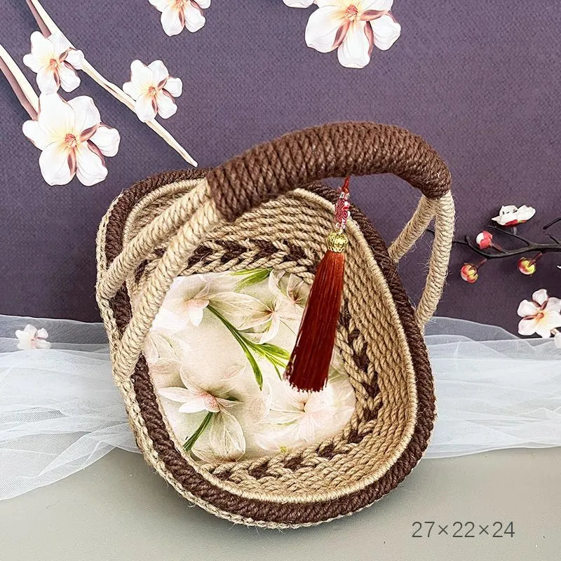 Coffee brown hand-woven hemp rope basket measuring 19 by 12 centimetres.