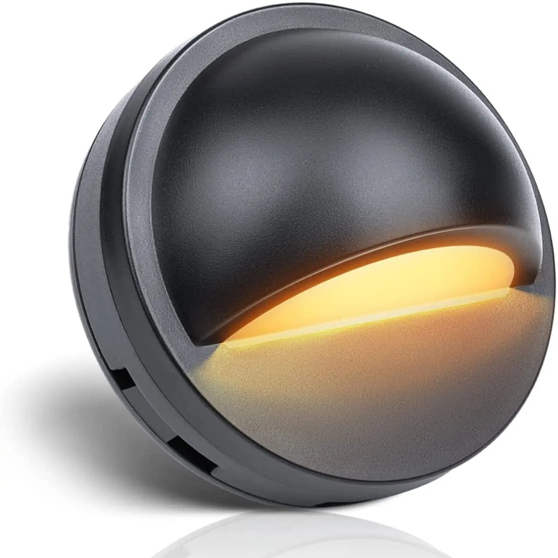 Platinum-coloured low voltage outdoor step light with IP67 rating for garden pathways.