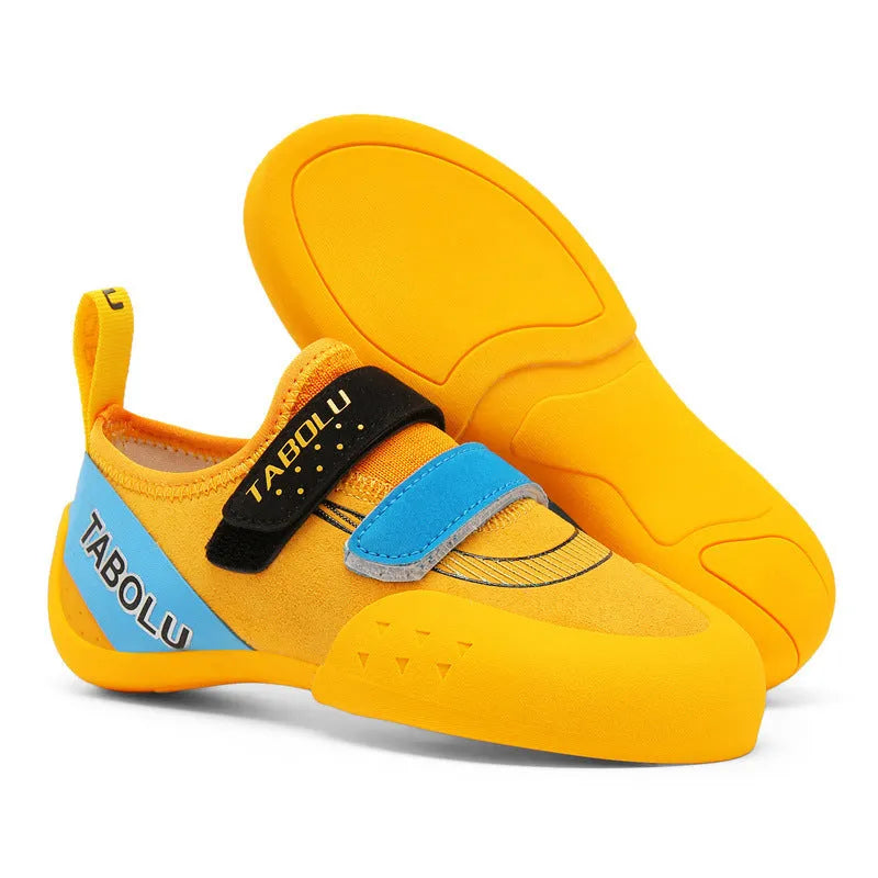 Beginner rock climbing shoes with Velcro fastening in black with red, orange yellow, or pink accents