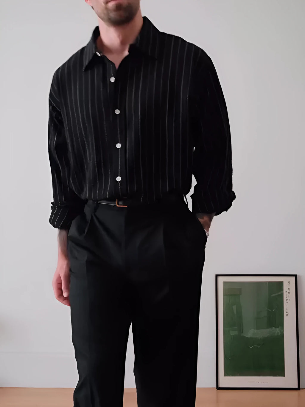 Black pinstriped button-down shirt with regular fit on a model.