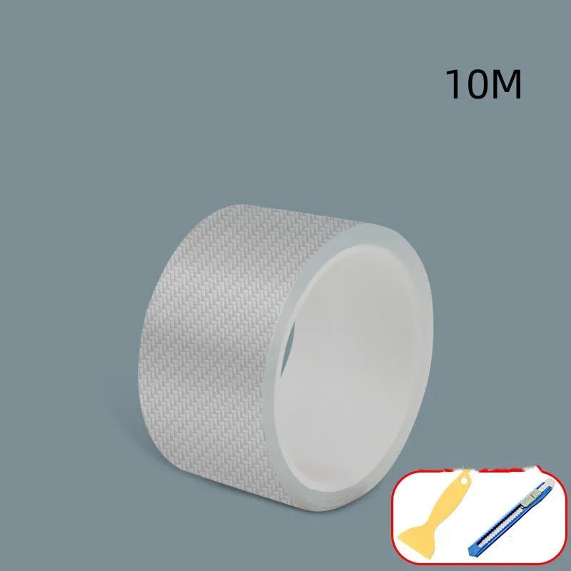Roll of carbon fibre grain car protection strip with scraper and utility knife for door edge installation.