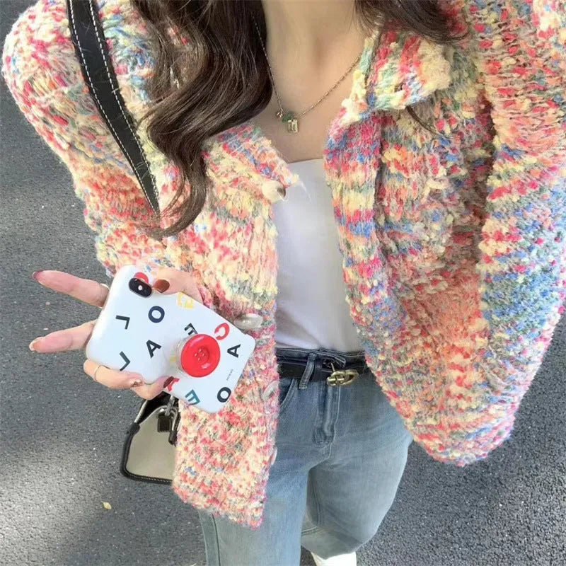 Pink or green retro-style rainbow patterned knitted cardigan on a model.