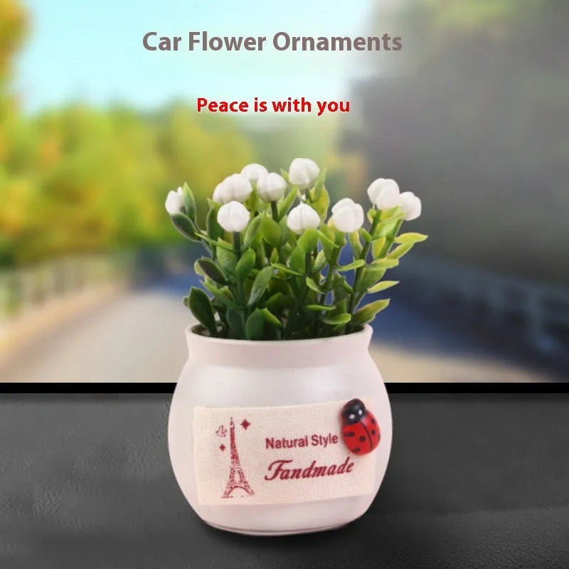 Auspicious fruit potted plant car ornament in a plastic vase, available in black or white, for car interior decoration and odour removal