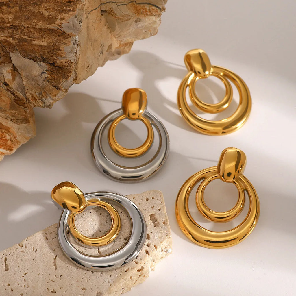 Golden round double layer hollow stud earrings with geometric design and 18K gold electroplating